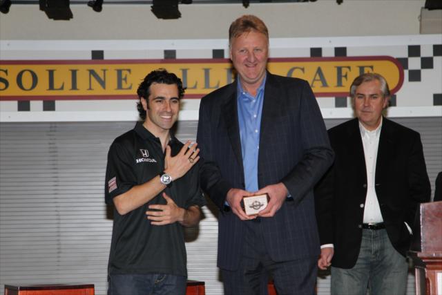 View 3/18/11 Dario Franchitti Receives Indy 500 ring from Larry Bird Photos